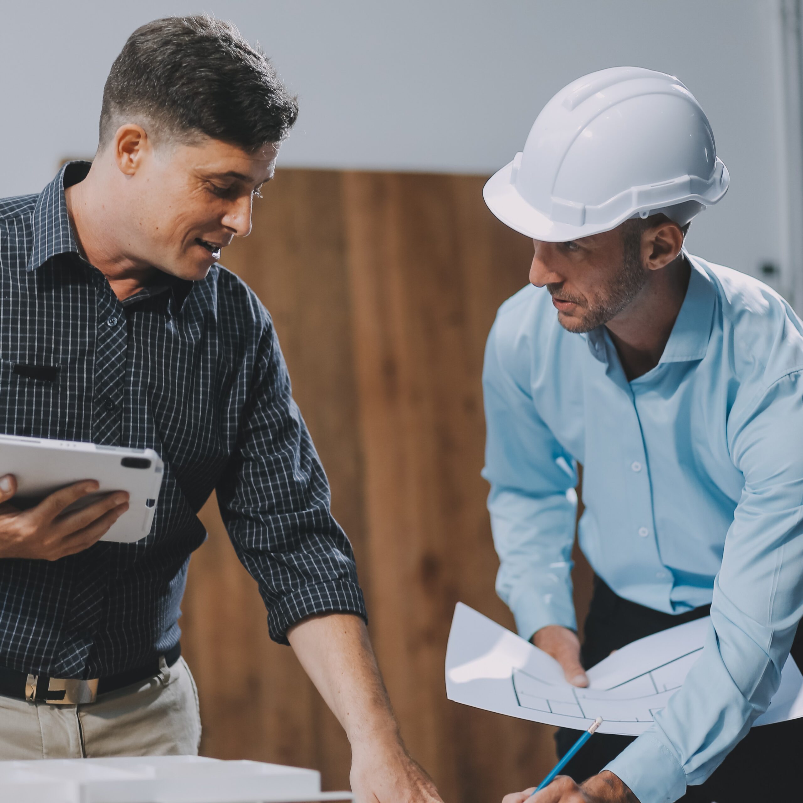 Team Engineers with draft plan of building on constructing site. Engineer work on site. engineer visit and inspection site engineer. Inspector engineer check and working on site.